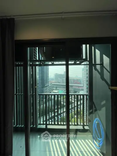 Modern balcony with city view and glass railing in urban apartment