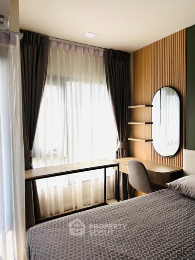 Modern bedroom with stylish decor, large window, and elegant furnishings.