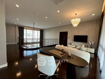 Luxurious living room with elegant chandelier and modern decor