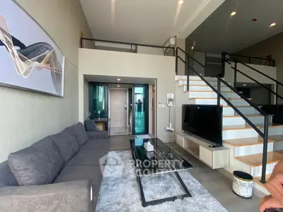 Modern duplex living room with stylish decor and mezzanine level