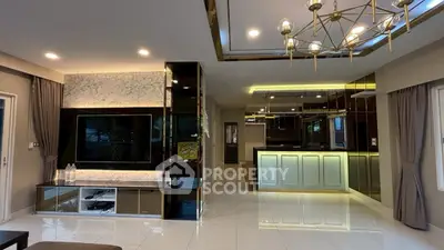 Luxurious modern living room with elegant lighting and glossy finishes