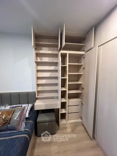 Modern bedroom with built-in storage and stylish bed setup