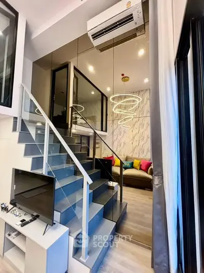 Modern duplex living room with stylish staircase and chic decor