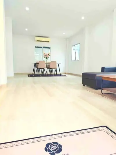 Spacious modern living room with elegant dining area and stylish furniture