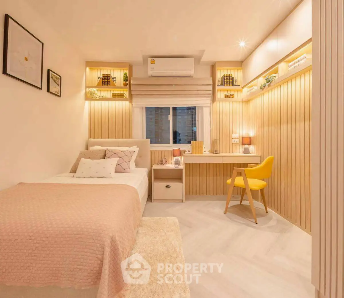 Modern cozy bedroom with built-in desk and warm lighting