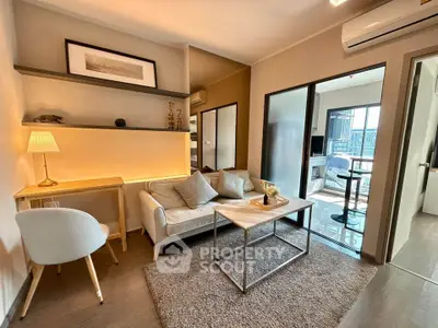 Modern living room with cozy seating and stylish decor in a contemporary apartment.