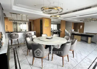 Luxurious dining room with elegant marble flooring and modern chandelier