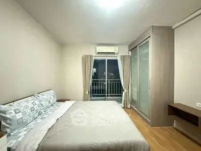 Modern bedroom with balcony view and stylish decor