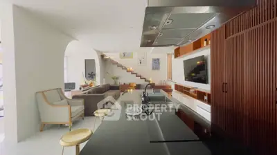 Modern open-plan living room with sleek kitchen and stylish staircase