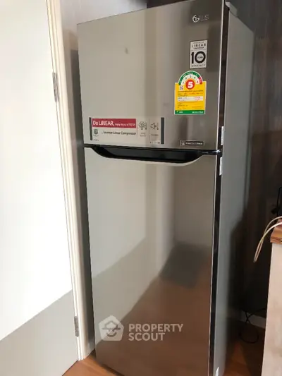 Modern stainless steel refrigerator in a stylish kitchen setting