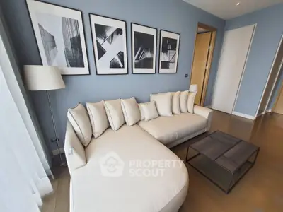 Stylish modern living room with elegant sofa and artistic wall decor