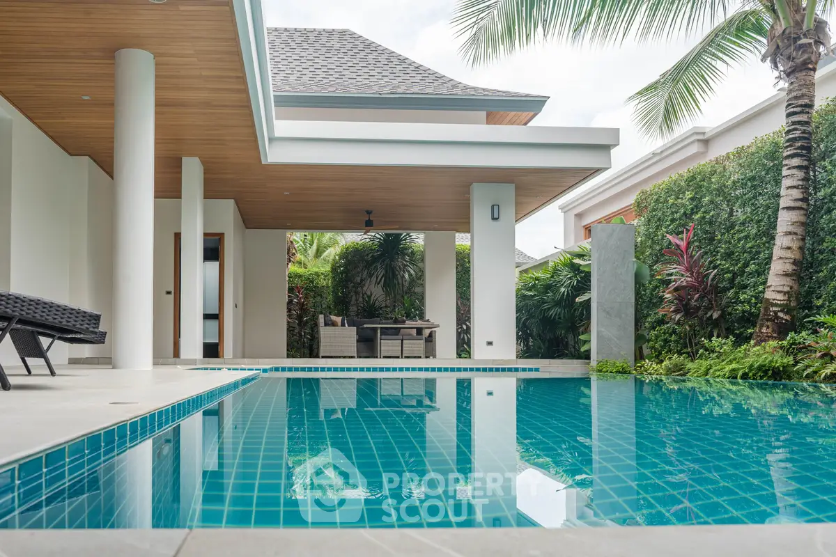 Luxurious tropical villa with private pool and lush garden, perfect for relaxation and entertaining.