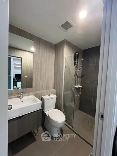 Modern bathroom with sleek design and glass shower enclosure