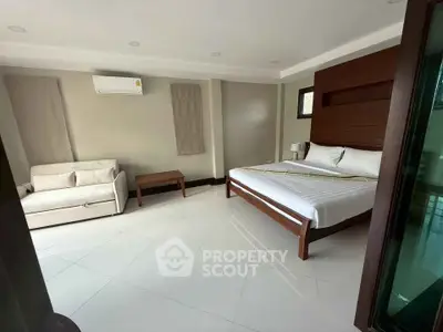 Spacious modern bedroom with sleek design and natural light