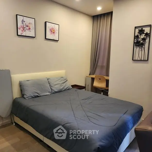 Cozy bedroom with modern decor and comfortable bed in stylish apartment.