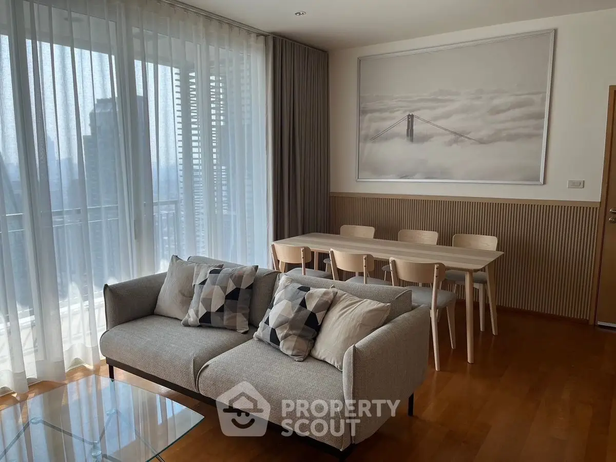 Modern living room with stylish decor and large window view