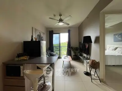 Modern apartment living room with open layout and scenic view, featuring stylish furniture and natural light.