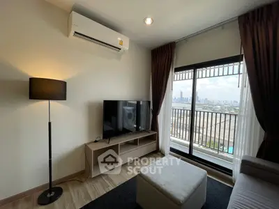 Modern living room with city view, featuring air conditioning and stylish decor.