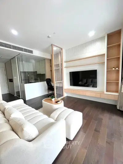 Modern living room with sleek design, open layout, and stylish furniture in a contemporary apartment.