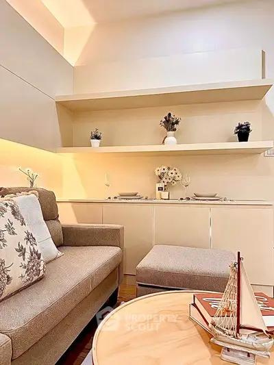 Chic living room with cozy sofa, elegant decor, and ambient lighting for a warm atmosphere.