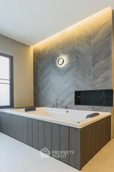 Luxurious modern bathroom with stylish bathtub and elegant lighting