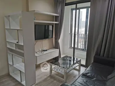 Modern living room with sleek furniture and city view balcony