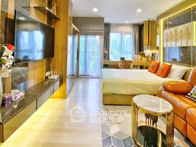 Luxurious modern bedroom with stylish decor and open layout, featuring a cozy seating area and elegant lighting.