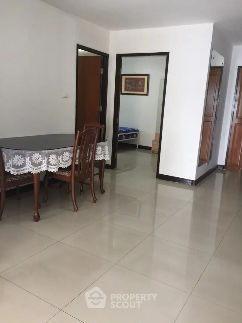 Spacious apartment interior with tiled floors and dining area