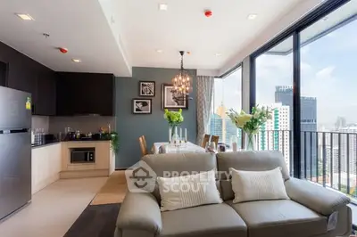 Modern open-plan living room with city view and elegant decor