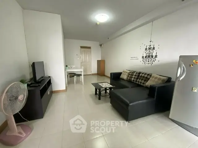 Spacious living room with modern decor and comfortable seating