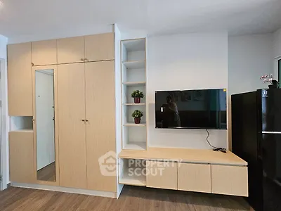 Modern living room with built-in storage and sleek TV setup