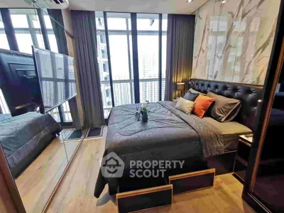Luxurious bedroom with floor-to-ceiling windows and modern decor in high-rise apartment.