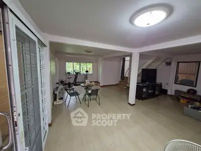 Spacious living room with exercise equipment and modern decor