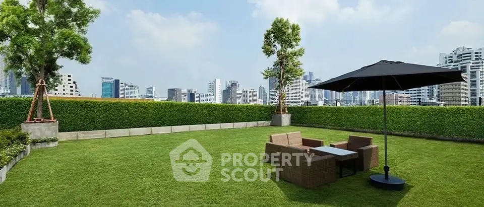 Spacious rooftop garden with city skyline view and outdoor seating area.