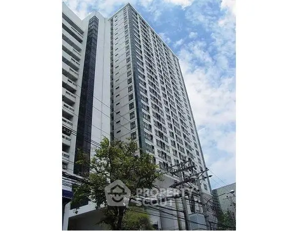 Modern high-rise building with clear blue sky backdrop