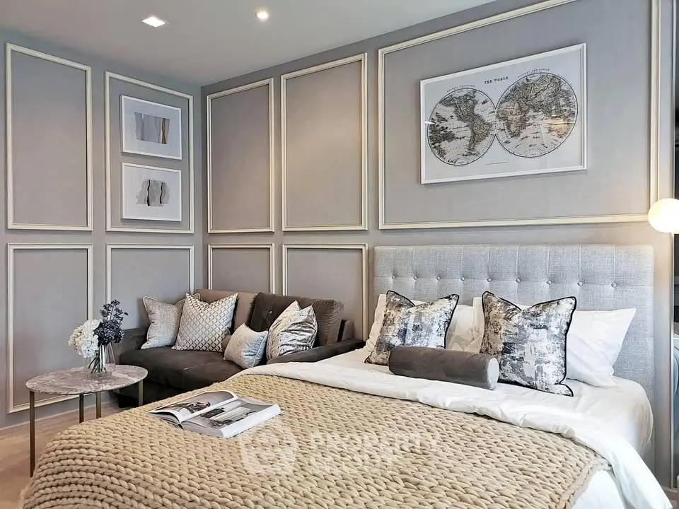 Luxurious bedroom with elegant decor, plush bedding, and stylish wall art, perfect for modern living.