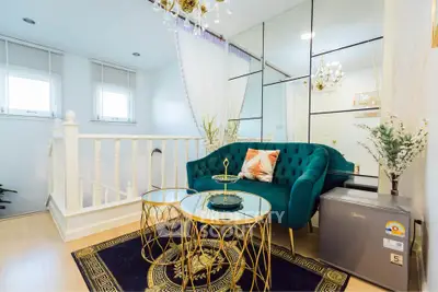 Luxurious living room with elegant decor and plush seating in a modern home.
