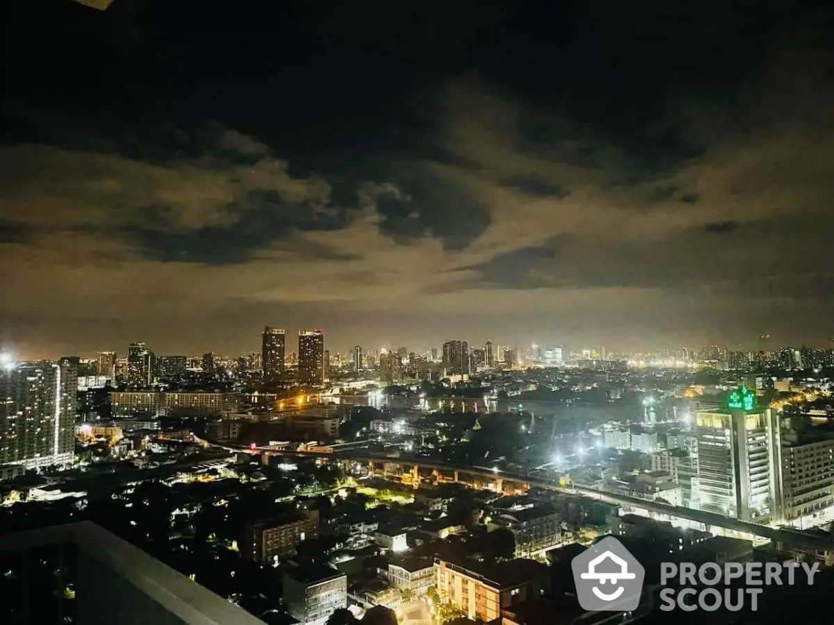 Stunning city skyline view at night with illuminated buildings and vibrant cityscape.