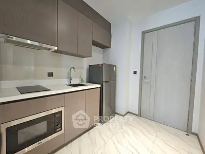 Modern kitchen with sleek cabinetry and stainless steel appliances