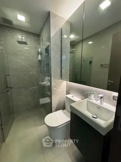 Modern bathroom with sleek design and glass shower enclosure