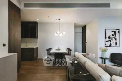 Modern open-plan living room with stylish dining area and contemporary decor