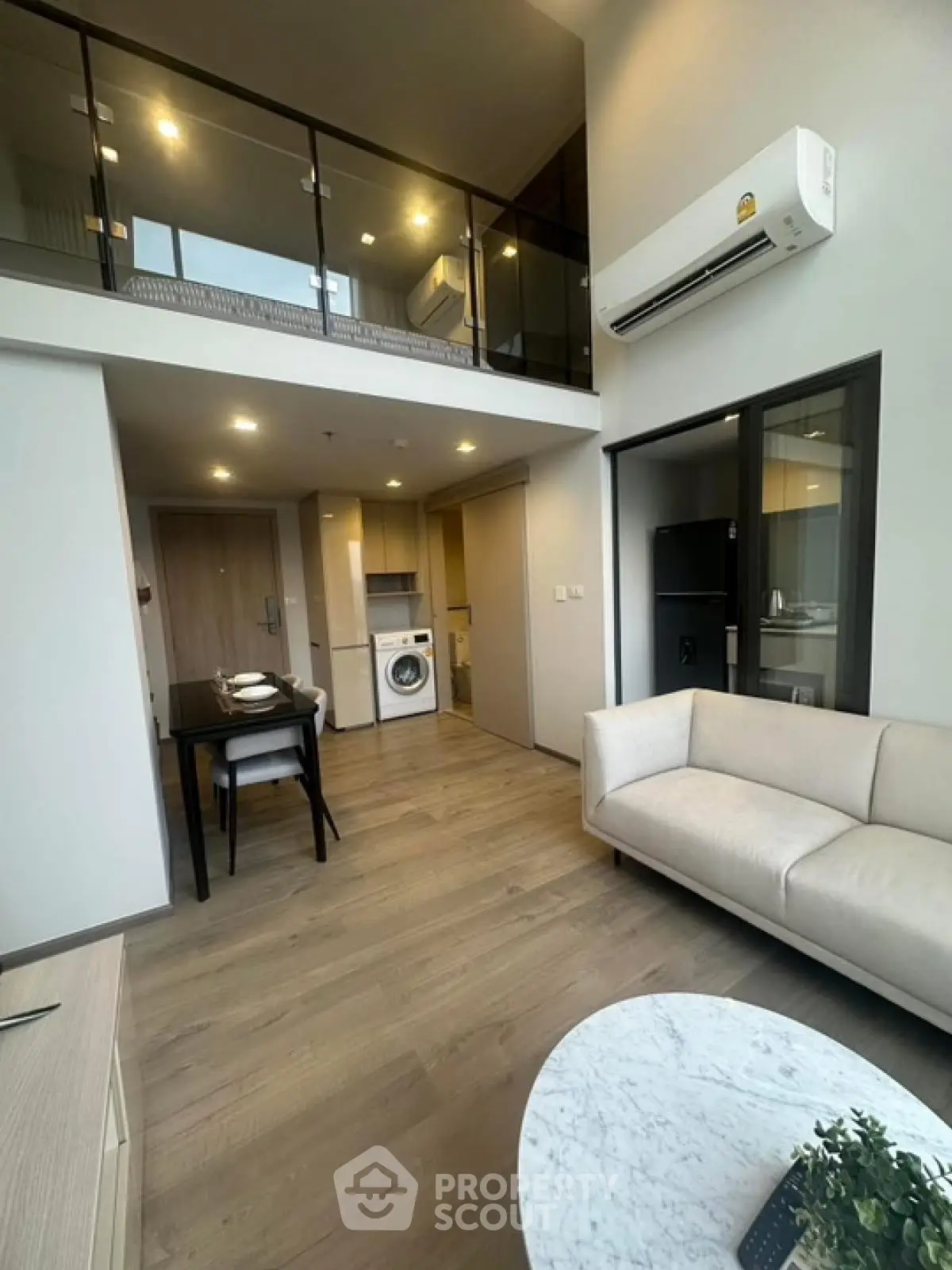 Modern loft apartment with open living space and mezzanine bedroom