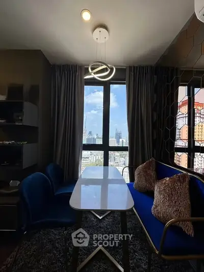 Chic modern living room with city view, stylish furniture, and elegant lighting.