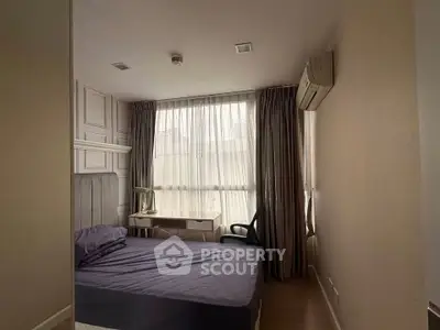 Cozy bedroom with natural light and modern furnishings in urban apartment