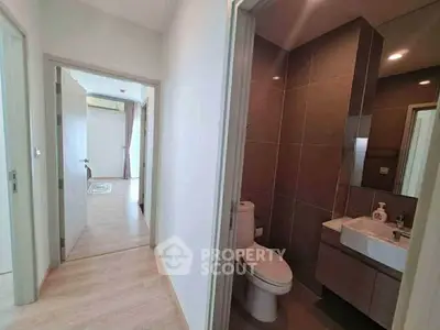 Modern apartment hallway with bathroom and bedroom view