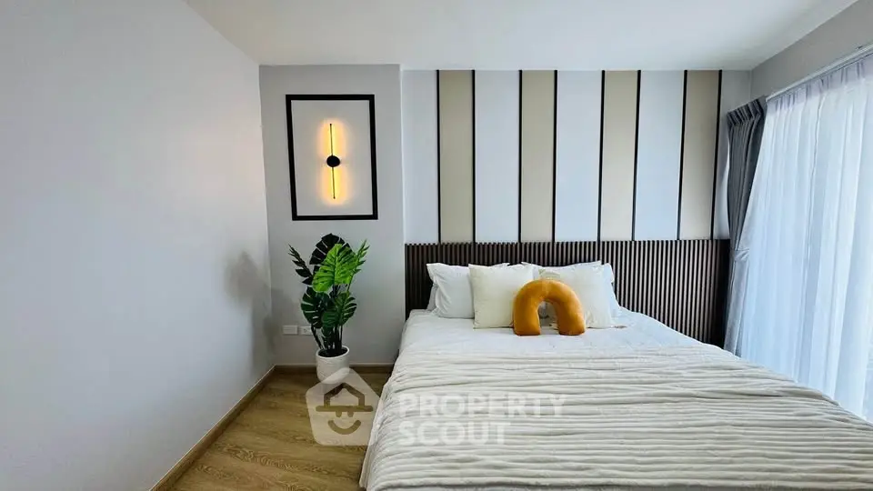 Modern bedroom with stylish decor and natural light
