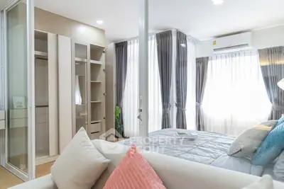 Modern bedroom with elegant decor and ample natural light