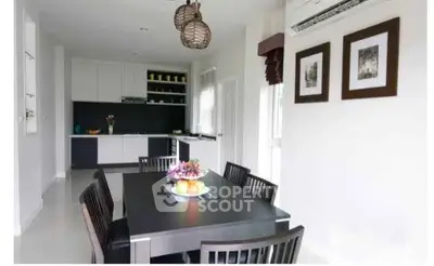 Modern dining area with sleek kitchen design and stylish decor