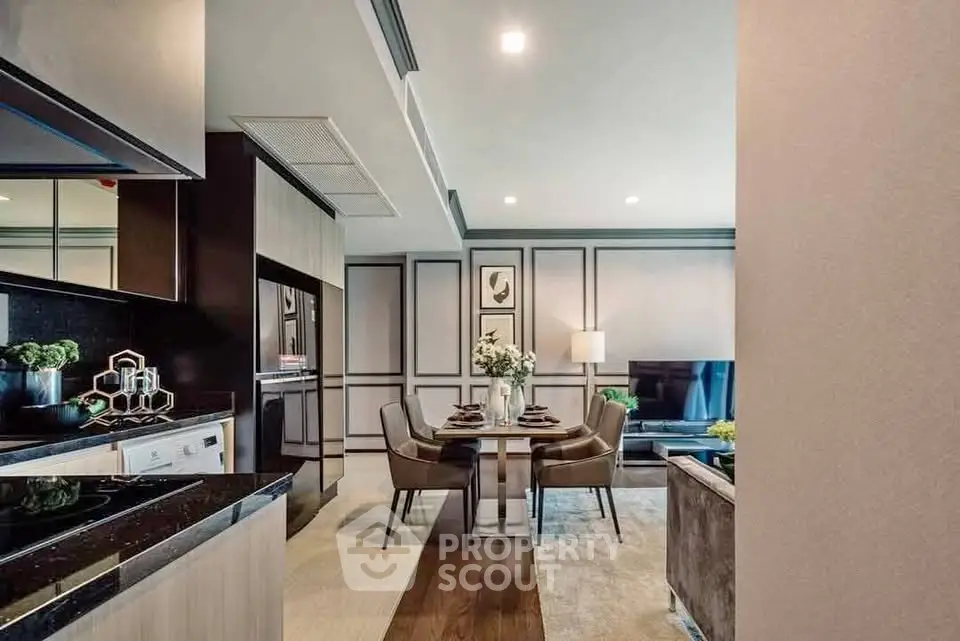 Modern open-plan living and dining area with sleek kitchen design