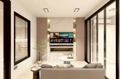 Modern living room with sleek design, large TV, and stylish furniture in a contemporary home.